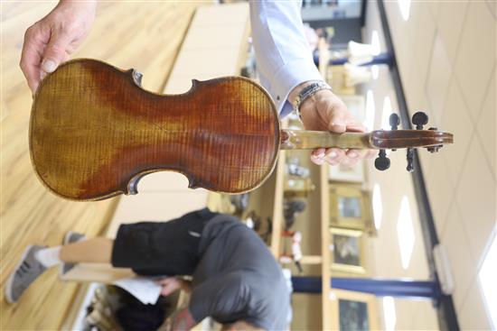 A late 19th century German violin, bears Stradivarius label, cased with bow, back 36cm